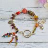 Beaded Bracelet with glass and colored stone beads and ray fish and starfish pendants