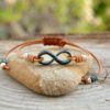 Infinity bracelet, adjustable leather with rustic and hippie green patina