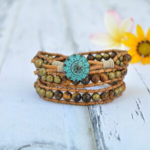 Three strand wrap bracelet with natural tiger eye beads, leather and turquoise blue button.