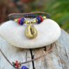 Ethnic adjustable choker with bronze cowrie shell pendant and recycled glass beads