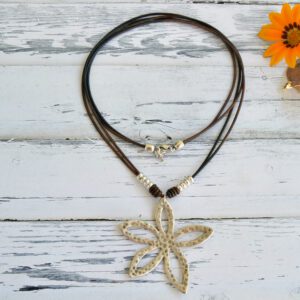 Long necklace with two leather cords and a silver plated zamak flower pendant with carabiner clasp.