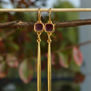 Extra long gold-plated earrings with dark pink crystal studs and posts. Hippie hooks