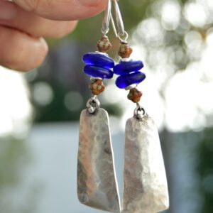 Ethnic earrings with rectangular silver pendants and blue African recycled glass beads and with hypoallergenic hippie hooks