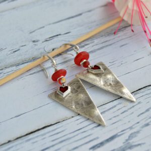 Earrings with arrowhead pendant and red heart charm, with red recycled glass beads and hypoallergenic silver hooks