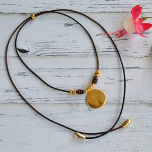 Adjustable leather choker with gold-plated round pendant